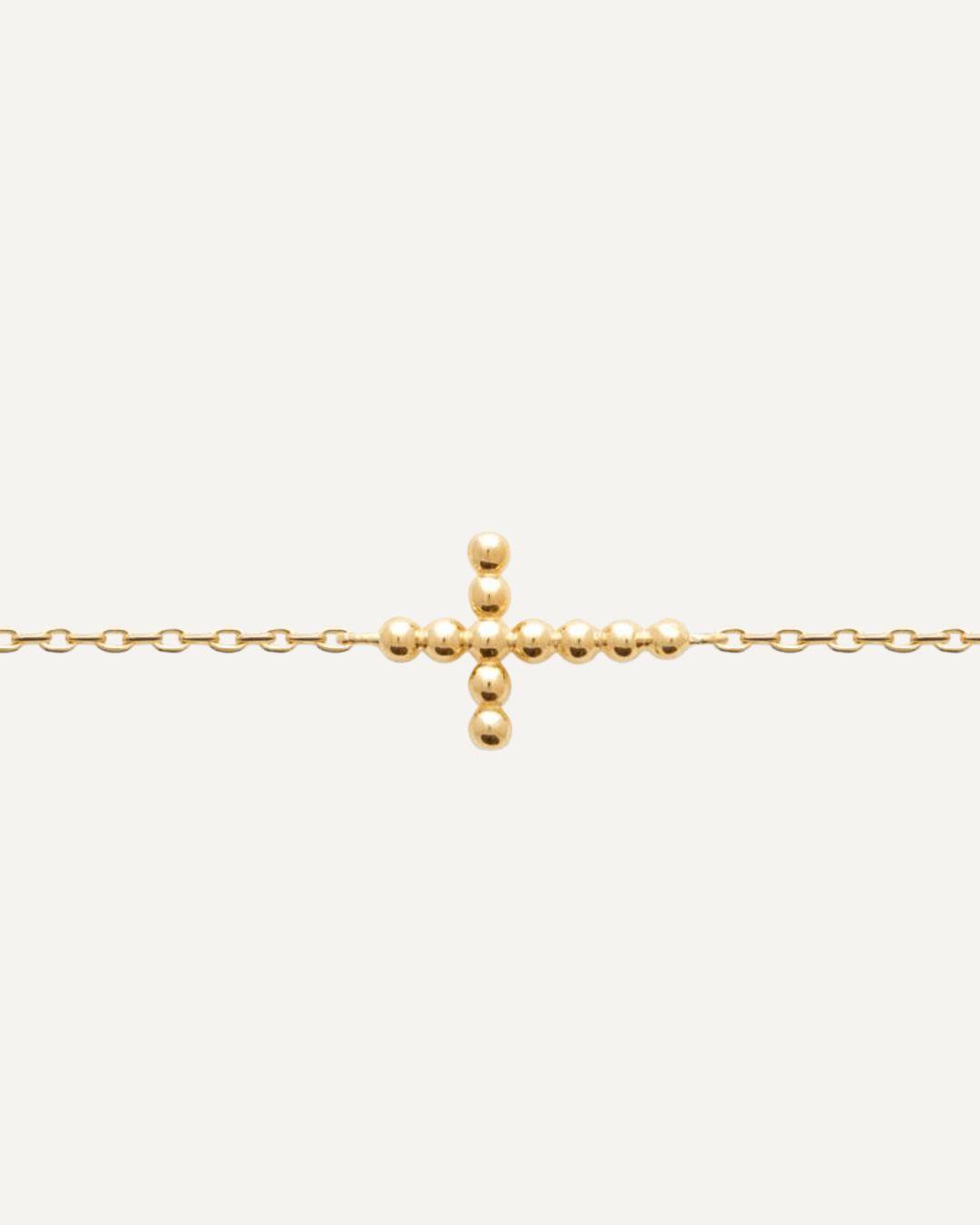 Bracelet fin croix en plaqué or 18 carats